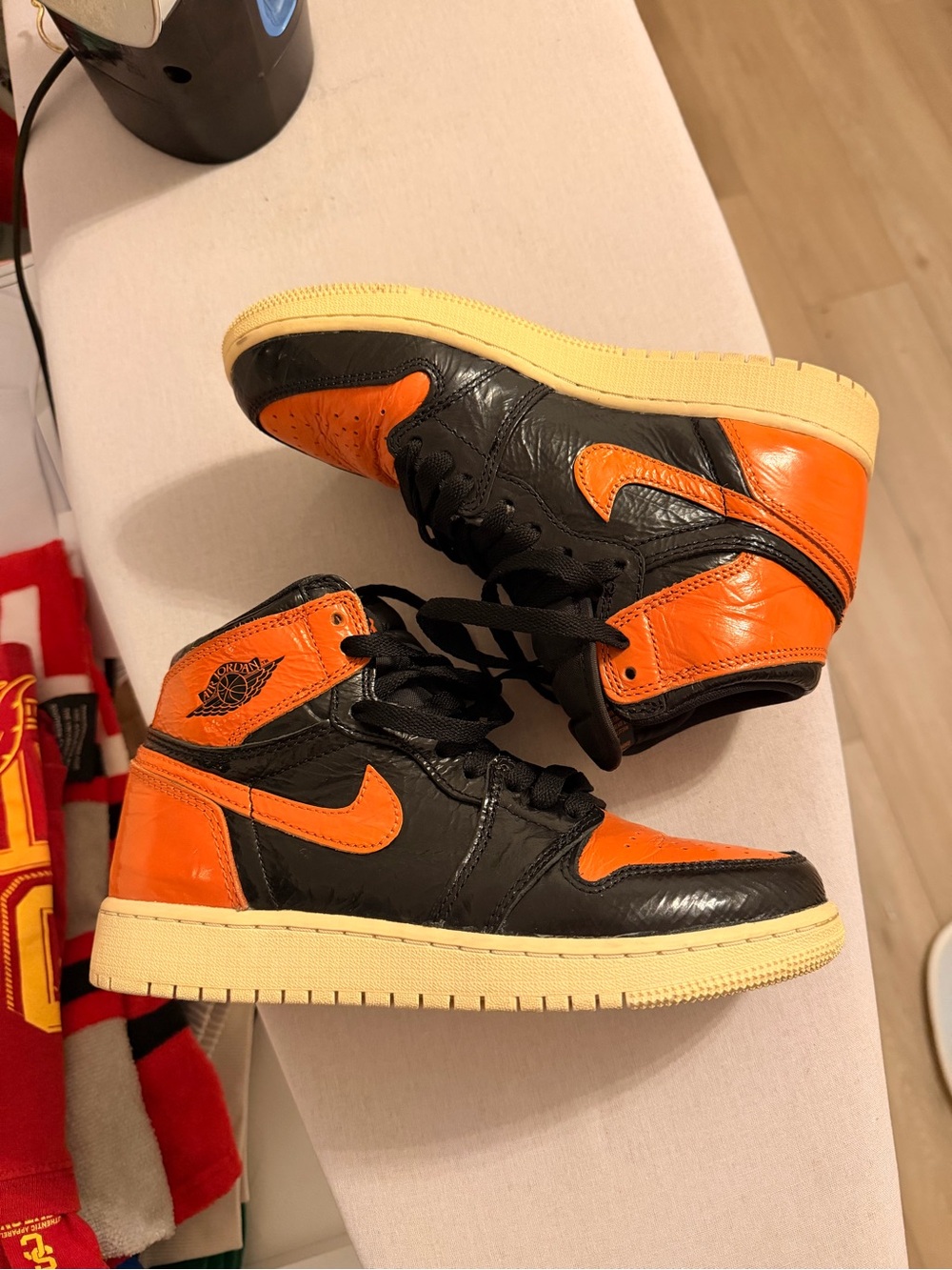 Jordan High-Top Sneakers in Black & Orange